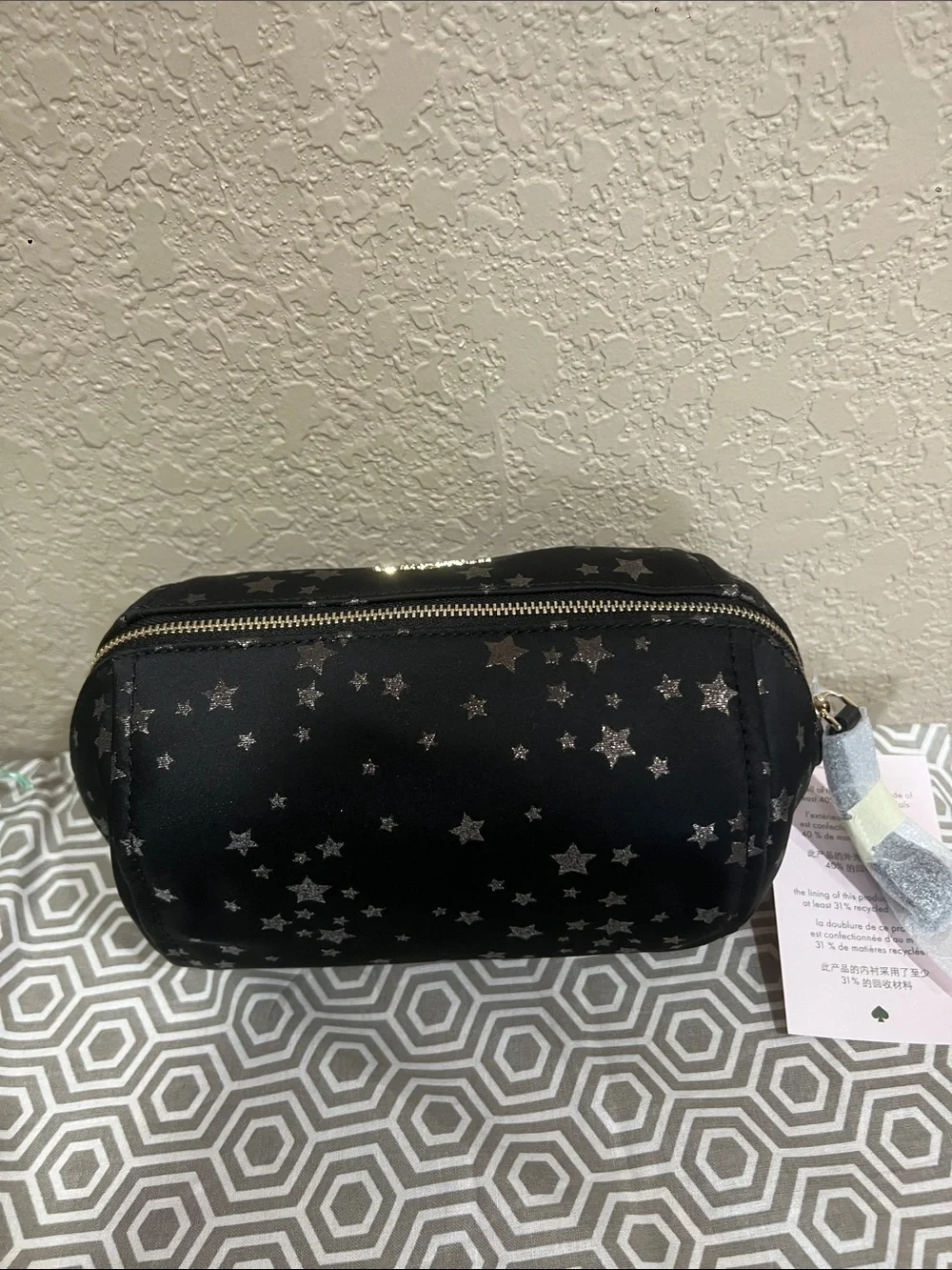 kate spade black cosmetic pouch with silver star print